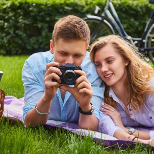 loving-young-couple-photo-shooting-and-relaxing-in-a-park-.jpg